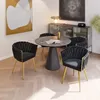 A dining set with chairs around a table in a room. Produktbild-Vorschau