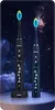 Two electric toothbrushes are displayed against a starry night sky background. Náhled obrázku produktu