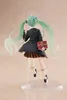 A figurine of Hatsune Miku in a school uniform, holding a gift box. Podgląd zdjęcia produktu