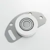 A close-up studio shot of a roller bearing assembly with a gray metal bracket. Produktbild-Vorschau