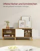 A modern TV stand with open shelves and a cabinet, decorated with framed art and a vase of flowers. Produktbild-Vorschau