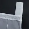 A close-up view of the top edge of a white sheer curtain, showing the fabric loops for hanging. Produktbild-Vorschau