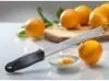 A kitchen knife and oranges on a counter. Anteprima dell’immagine prodotto