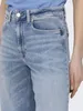Close-up of the top part of light blue denim jeans, showing the waistband, pockets, and a portion of the person's torso. Produktbild-Vorschau
