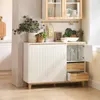 A kitchen sideboard with decorative items and fruit on top, and open drawers and a cabinet revealing contents. Produktbild-Vorschau