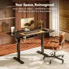 A modern home office setup with a standing desk and chair. Produktbild-Vorschau