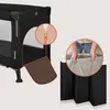 A travel crib with a close-up of a zipper and a close-up of hands adjusting a mattress. Voir les images du produit