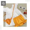 A flat lay of a baby's outfit. Podgląd zdjęcia produktu