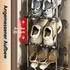A close-up view of a multi-tiered shoe rack holding various shoes, with text overlays indicating dimensions. Produktbild-Vorschau