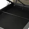 Close-up view of the interior of a bed frame, showing the lifting mechanism and the slatted base. Produktbild-Vorschau