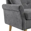 A close-up view of the armrest and side of a gray upholstered sofa. Produktbild-Vorschau