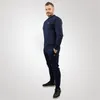 A man wearing a navy blue tracksuit. Anteprima dell’immagine prodotto
