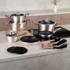 A set of rose gold cookware displayed on a kitchen countertop. Produktbild-Vorschau