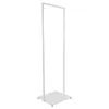 A white, freestanding garment rack with a rectangular base and a vertical frame. Náhled obrázku produktu