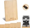A collage showing a large bamboo cutting board, several smaller bamboo boards, and a coffee maker on a bamboo base. Anteprima dell’immagine prodotto