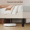 A low-angle shot of a bed frame with a robot vacuum cleaner underneath, showcasing storage space. Produktbild-Vorschau