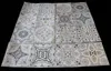 A collection of square floor or wall stickers with a mosaic tile pattern, laid out on a black surface. Produktbild-Vorschau