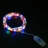 A coiled string of colorful LED lights with a battery pack. Produktbild-Vorschau