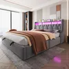 A modern bedroom with a large bed featuring LED lighting. Náhled obrázku produktu