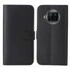 A black flip case for a smartphone is shown open, displaying both the inside and outside of the case. Produktbild-Vorschau