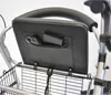 Close-up view of the back of a rollator seat with a pocket holding a wallet and keys. Produktbild-Vorschau
