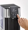 A hand is shown pressing a button on the control panel of a hot water dispenser. Anteprima dell’immagine prodotto