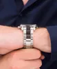A close-up shot of a man's wrist wearing a Maserati watch. Produktbild-Vorschau