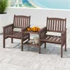 A wooden garden bench set with a table on a patio overlooking the ocean. Produktbild-Vorschau