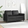 A black sofa in a room with artwork and a mirror. Produktbild-Vorschau
