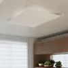 A white rectangular ceiling light fixture is shown suspended from a concrete ceiling. Produktbild-Vorschau