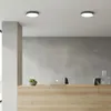 A modern office reception area with a desk, laptop, and decorative items. Náhľad obrázku produktu