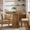 A dining set with a round table and two chairs in a cozy dining nook with built-in seating and shelves. Náhľad obrázku produktu