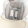 Close-up view of the padded seat and harness of a baby high chair. Anteprima dell’immagine prodotto