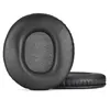 Two black ear pads for headphones are shown against a white background. One ear pad is shown from the front, and the other is shown from the side. Voir les images du produit