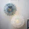 Two paper star lanterns hanging on a wall. Podgląd zdjęcia produktu