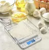 A digital scale with flour on it, surrounded by baking ingredients like eggs, oil, milk, and sugar. Produktbild-Vorschau