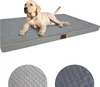 A light-colored puppy lies on a gray orthopedic dog bed. Produktbild-Vorschau