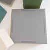 The underside of a gray foam climbing block with yellow trim, showing velcro strips for attachment. Anteprima dell’immagine prodotto