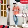 A man and a woman are standing in a doorway, looking at each other. The man is holding a tablet, and the woman is peeking out from behind a door. Podgląd zdjęcia produktu