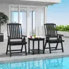 Two black folding chairs and a small black table are set up on a patio next to a swimming pool. Voir les images du produit