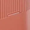 A close-up view of the textured surface of a piece of luggage, featuring a raised brand logo. Produktbild-Vorschau