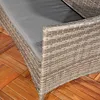 A close-up view of a gray polyrattan bench with a gray cushion, placed on a wooden deck. Produktbild-Vorschau