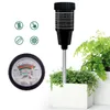 A soil moisture and pH meter is shown next to potted plants. The meter has a dial and a probe. Produktbild-Vorschau