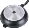 The underside of a black frying pan with a silver, textured bottom and a black handle. Anteprima dell’immagine prodotto