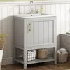 A light gray vanity cabinet with a white sink and a gold handle is shown in a bathroom setting. Voir les images du produit