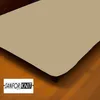 A close-up view of a sand-colored fitted sheet on a bed, with a wooden floor visible below. Produktbild-Vorschau