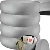 A stack of round, gray ottomans, with the bottom one open to reveal storage. Náhled obrázku produktu