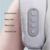 Nahaufnahme des Bedienfelds eines hellgrauen Massagegeräts mit Tasten für Ein/Aus, Modus, Wärme und Intensität, am Arm getragen Anteprima dell’immagine prodotto