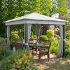A garden gazebo with furniture set up in a backyard garden. Produktbild-Vorschau