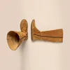 A pair of brown suede boots are laid out on a light beige background. Voir les images du produit